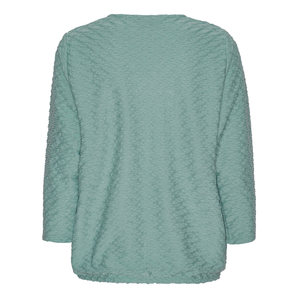 Mjuk blus med struktur och resårkant från Brandtex