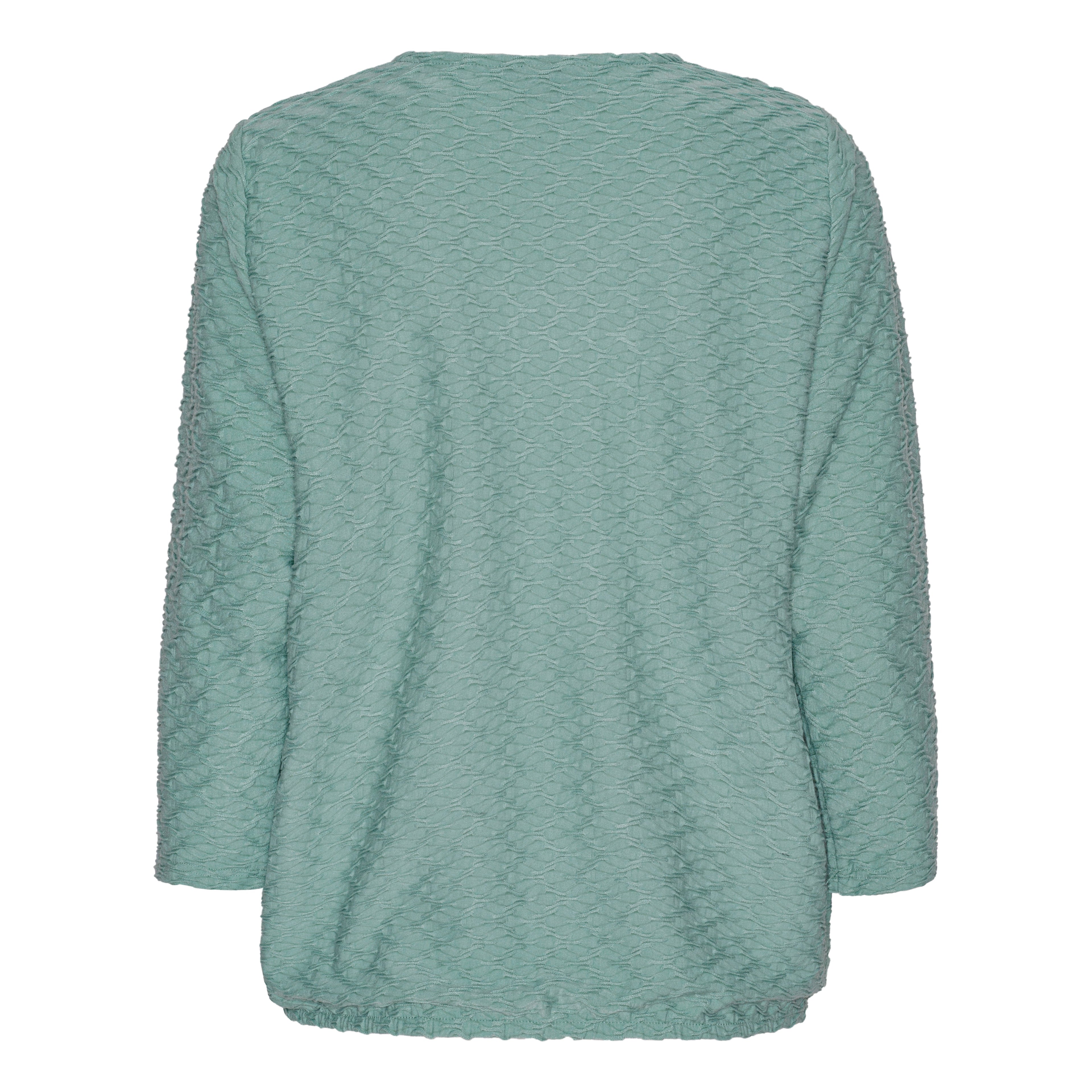 Mjuk blus med struktur och resårkant från Brandtex